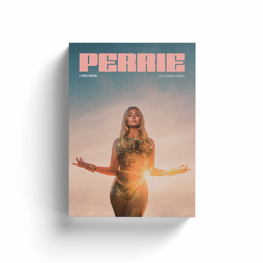 Front cover of the PERRIE lyric book, featuring Perrie standing in a gold outfit against a sunset backdrop, with the title ‘PERRIE’ in bold pink text at the top.