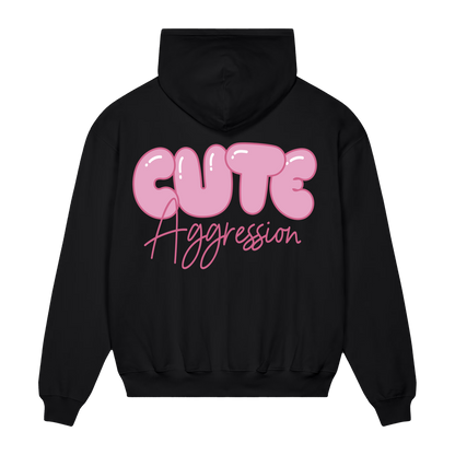 Black hoodie with pink 'Cute Aggression'  text across the back